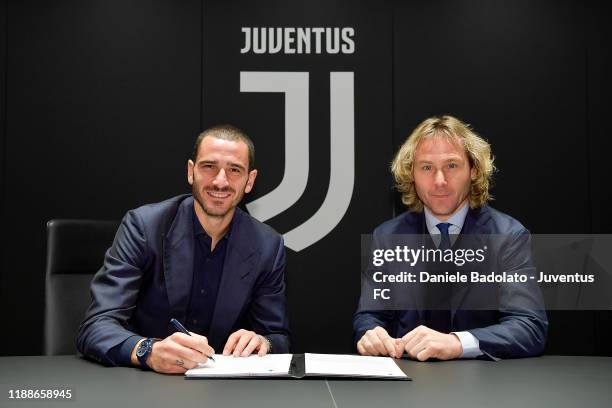 Leonardo Bonucci poses with Pavel Nedved as he extends his contract with Juventus on November 19, 2019 in Turin, Italy.