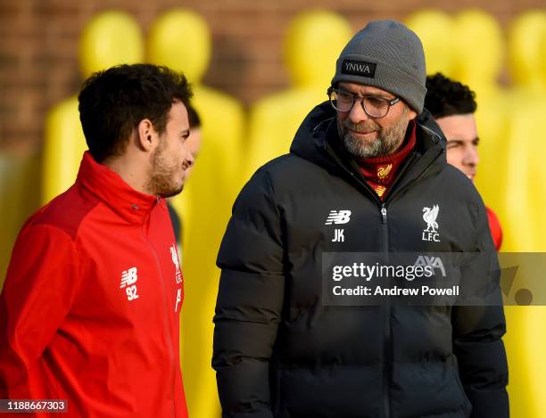 Jurgen Klopp manager of Liverpool talking with Pedro Chirivella during a training session at Melwood Training Ground on November 19, 2019 in...