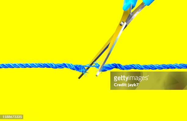 cutting a rope - scissors stock pictures, royalty-free photos & images