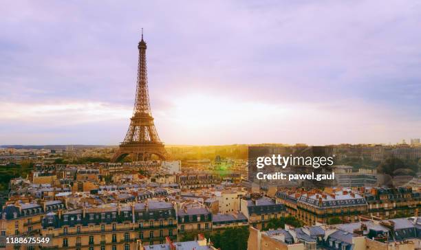 aerial view of paris with eiffel tower during sunset - paris france at night stock pictures, royalty-free photos & images