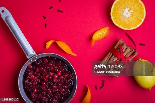 thanksgiving cranberry sauce in rural pan with fresh orange and lemon fruits - winter jam stock pictures, royalty-free photos & images