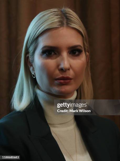 White House Senior Advisor Ivanka Trump listens to her father U.S. President Donald Trump speak to the media during a cabinet meeting at the White...