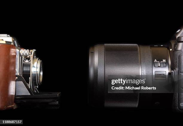 old fashioned camera and modern camera - with new era stock pictures, royalty-free photos & images