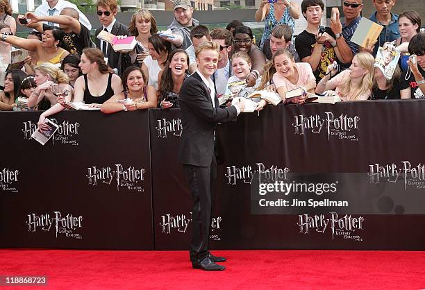 Actor Tom Felton and fans attend the premiere of "Harry Potter and the Deathly Hallows - Part 2" at Avery Fisher Hall, Lincoln Center on July 11,...