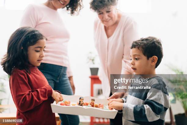 mexican family doing las posadas. nativity scene - carol singer stock pictures, royalty-free photos & images