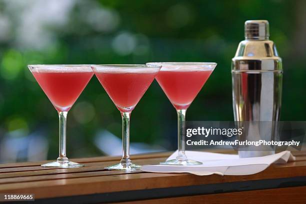 cocktails cosmopolitan - cocktail shaker stock pictures, royalty-free photos & images