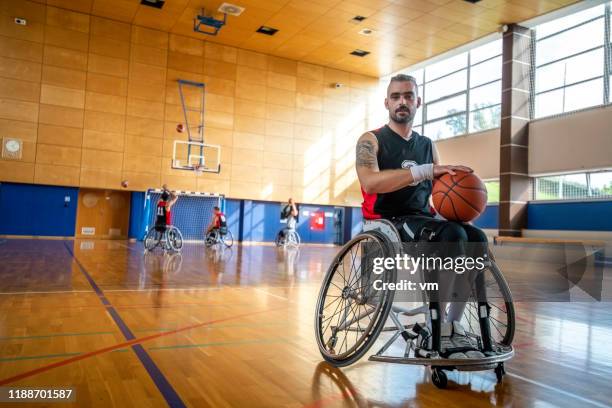 portrait of a wheelchair basketball player during practice - paraplegic stock pictures, royalty-free photos & images