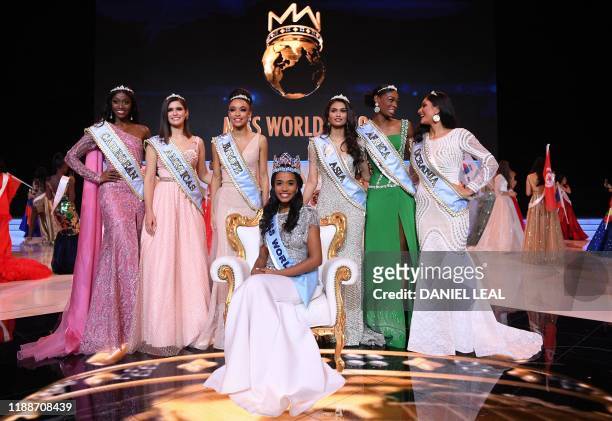 Newly crowned Miss World 2019 Miss Jamaica Toni-Ann Singh smiles as she poses with her crown during the Miss World Final 2019 at the Excel arena in...