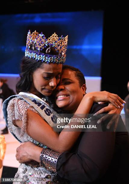 Newly crowned Miss World 2019 Miss Jamaica Toni-Ann Singh embraces her mother during the Miss World Final 2019 at the Excel arena in east London on...