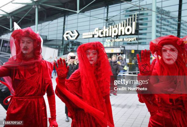 Greenpeace and Extinction Rebellions environmental activists during protest at the Schiphol Airport on December 14, 2019 in Amsterdam,Netherlands....