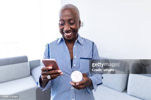 woman calling her pharmacist - prescription medicine stock pictures, royalty-free photos & images