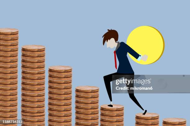 man walking on steps made of coins with a coin - man fallen up the stairs stock pictures, royalty-free photos & images