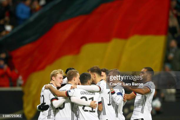 Serge Gnabry of Germany celebrates with his team mates after scoring his team's third goal during the UEFA Euro 2020 Qualifier between Germany and...