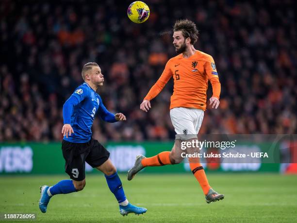 Davy Proepper of Netherlands challenges for the ball with Erik Sorga of Estonia during the UEFA Euro 2020 Qualifier between The Netherlands and...