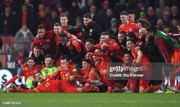 Wales player Aaron Ramsey joins in the celebrations with his team mates after the UEFA Euro 2020 qualifier between Wales and Hungary at Cardiff City...