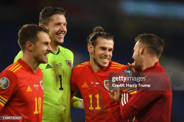 Aaron Ramsey of Wales , Wayne Hennessey of Wales , Gareth Bale of Wales and Chris Gunter of Wales celebrate after the final whistle during the UEFA...