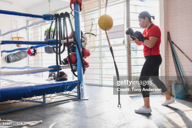 woman working out in boxing gym - gul handske bildbanksfoton och bilder