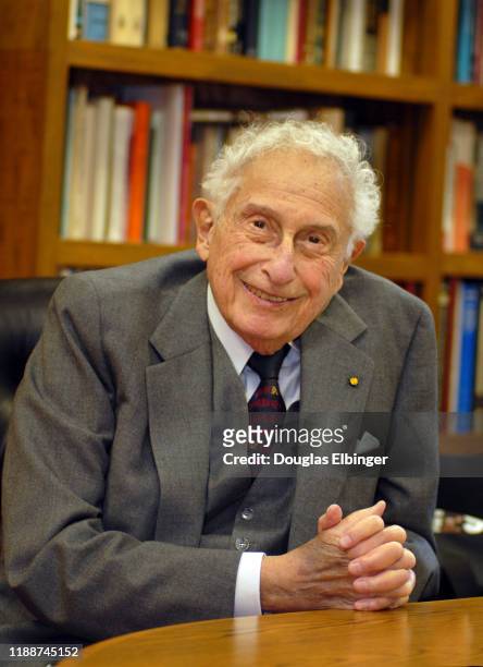 Portrait of American inventor, scientist, and engineer Stanford Robert Ovshinsky as he sits a desk, Bloomfield Hills, Michigan, November 7, 2008.