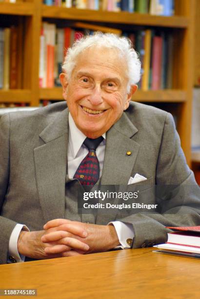 Portrait of American inventor, scientist, and engineer Stanford Robert Ovshinsky as he sits a desk, Bloomfield Hills, Michigan, November 7, 2008.