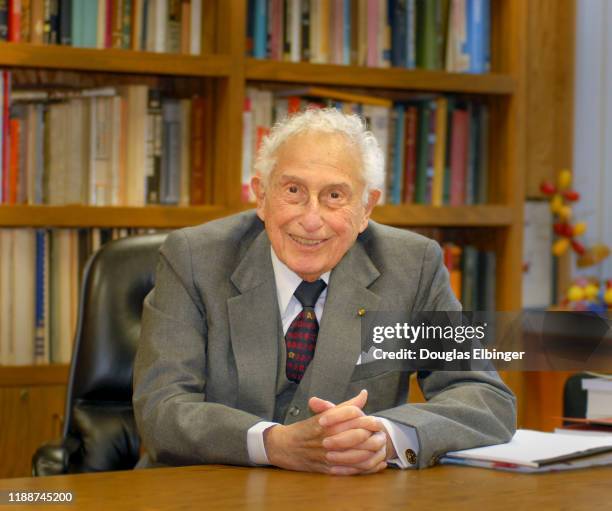 Portrait of American inventor, scientist, and engineer Stanford Robert Ovshinsky as he sits a desk, Bloomfield Hills, Michigan, November 7, 2008.