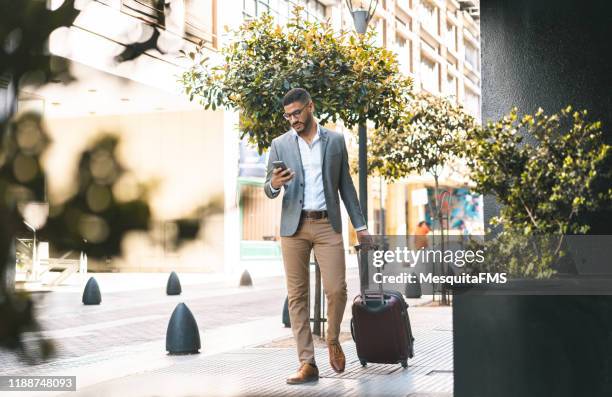 businessman entering in hotel - classic mens day 1 stock pictures, royalty-free photos & images