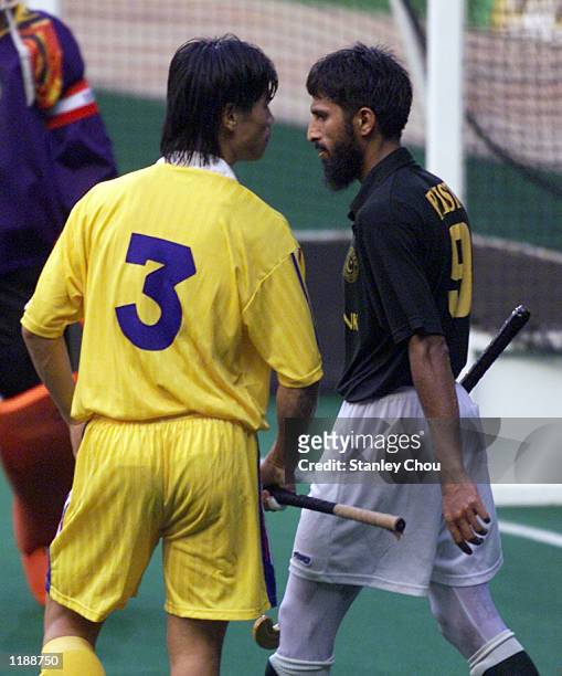 Chua Boon Huat of Malaysia confronted Tariq Imran of Pakistan at the match between Pakistan and Malaysia during the Sultan Azlan Shah Cup...