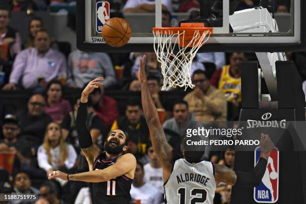 Phoenix Suns' Spanish point guard Ricky Rubio vies for the ball with San Antonio Spurs' US center LaMarcus Aldridge during an NBA Global Games...