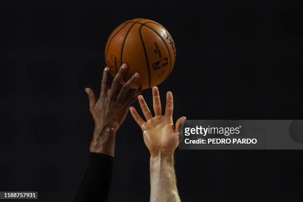 San Antonio Spurs' US center LaMarcus Aldridge vies for the ball with Phoenix Suns' Australian center Aron Baynes during an NBA Global Games...