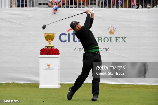 Hideki Matsuyama of the International team hits a tee shot on the first hole during the final round singles matches at the Presidents Cup at The...