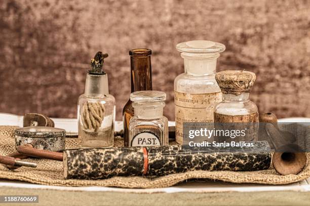 old glass bottles for medicines - antique-medical-tools stock pictures, royalty-free photos & images