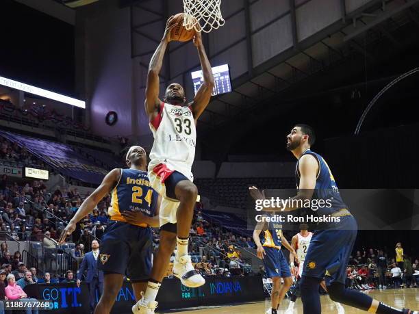 Alize Johnson and Goga Bitadze of the Fort Wayne Mad Ants defend Vitto Brown of the Erie Bayhawks on December 14, 2019 at Memorial Coliseum in Fort...