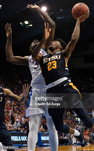 Vonnie Patterson of the East Tennessee State Buccaneers lays the ball up against Udoka Azubuike of the Kansas Jayhawks during the second half at...