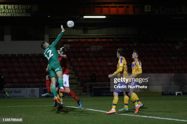 Robert Olejnik of Mansfield Town palms the ball away to thwart another Crewe attack during the Sky Bet League 2 match between Crewe Alexandra and...