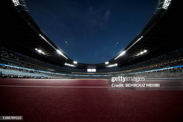 The National Stadium, venue for the upcoming Tokyo 2020 Olympic Games, is seen during a media tour following the stadium's completion in Tokyo on...