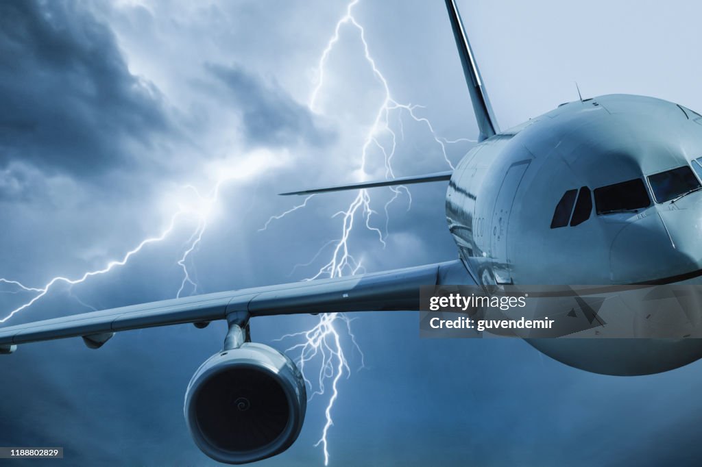 Jet travelling through stormy sky