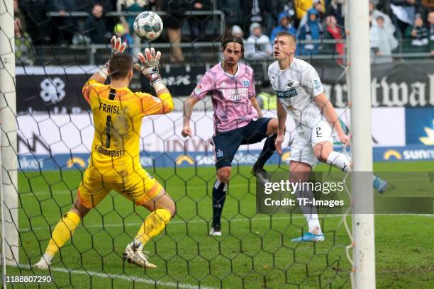 Goalkeeper Martin Fraisl of SV Sandhausen, Martin Harnik of Hamburger SV and Aleksandr Zhirov of SV Sandhausen battle for the ball during the Second...