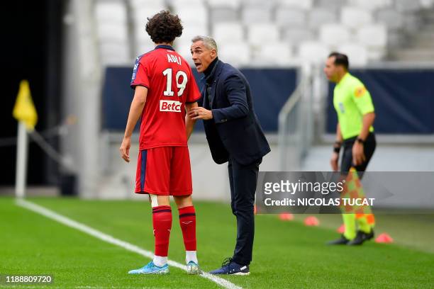 Bordeaux's French midfielder Yacine Adli listens to Bordeaux's Portuguese head coach Paulo Sousa during the French Ligue 1 football match between...