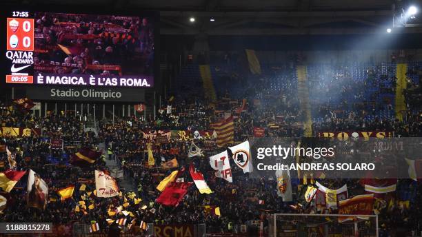 Roma fans cheer prior to the Italian Serie A football match AS Roma vs Spal on December 15, 2019 at the Olympic stadium in Rome.