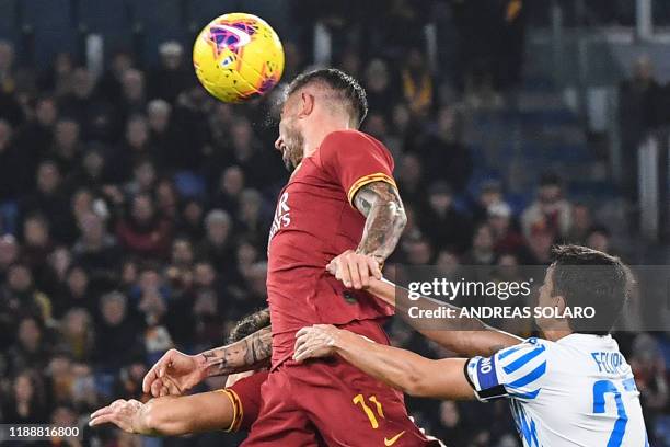 Roma's Serbian defender Aleksandar Kolarov goes for a header during the Italian Serie A football match AS Roma vs Spal on December 15, 2019 at the...