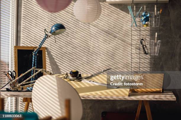 sunlight throwing shade on a home office through the window blinds - ruler desk stock pictures, royalty-free photos & images