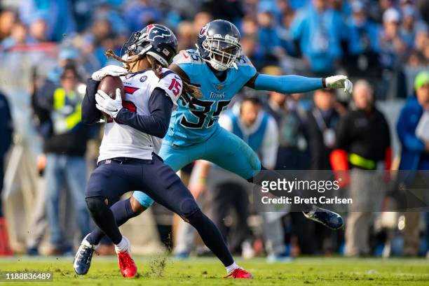Tramaine Brock of the Tennessee Titans is penalized for a face mask as he tackles Will Fuller of the Houston Texans during the second quarter at...