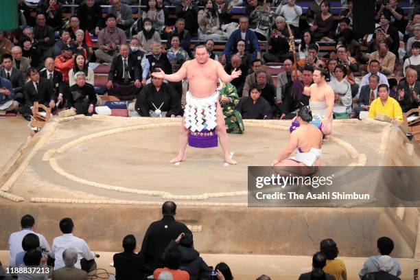 Mongolian yokozuna Hakuho performs the dohyo-iri, ring purification rite on day ten of the Grand Sumo Kyushu Tournament at the Fukuoka Convention...