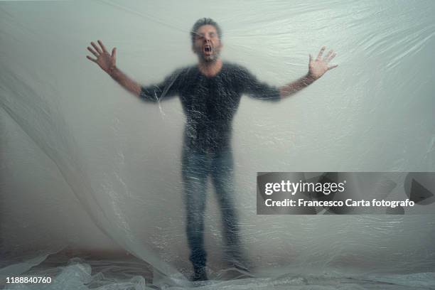 man trapped in plastic - suffocated stock-fotos und bilder