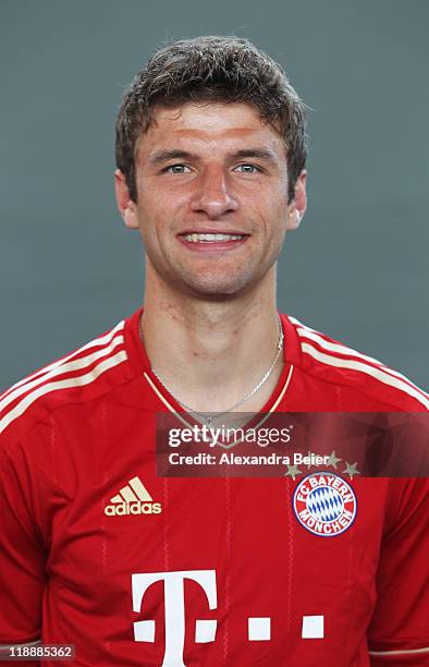 Thomas Mueller of Bayern Muenchen poses during the FC Bayern Muenchen team presentation for the upcoming season 2011/2012 at Bayern's training ground...