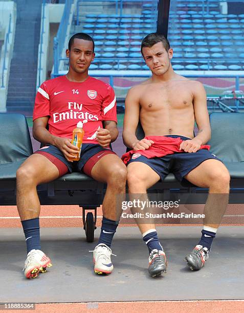 Theo Walcott and Jack Wilshere of Arsenal attend a traning session at Shah Alam Stadium during the club's pre-season Asian tour on July 12, 2011 in...