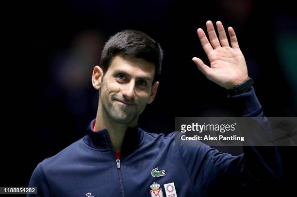 Novak Djokovic of Serbia waves to fans as he walks out ahead of his Davis Cup group stage match against Japan during Day Three of the 2019 Davis Cup...
