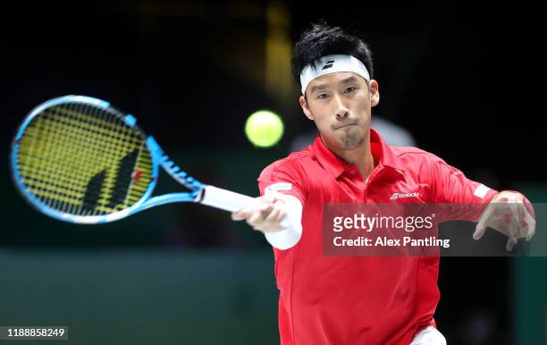 Yuichi Sugita of Japan plays a forehand shot during his Davis Cup Group Stage match against Filip Krajinovic of Serbia during Day Three of the 2019...