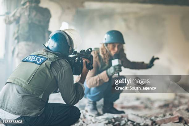 journalists in the war zone - conflict zone stock pictures, royalty-free photos & images