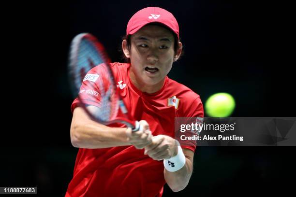 Yoshihito Nishioka of Japan plays a forehand shot during his Davis Cup group stage match against Novak Djokovic of Serbia during Day Three of the...