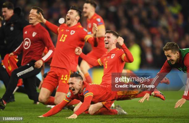 The Wales side celebrate victory at the final whistle during the UEFA Euro 2020 qualifier between Wales and Hungary so at Cardiff City Stadium on...